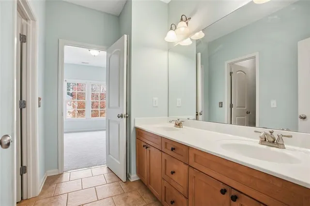 a bathroom with a sink a vanity and a mirror