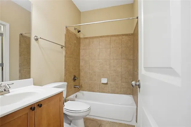 a bathroom with a sink a toilet and a bathtub