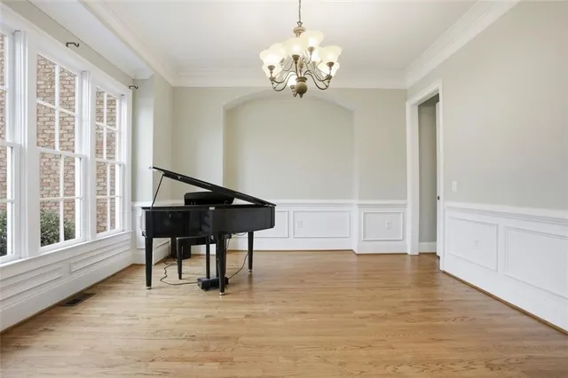 a view of a livingroom with furniture window and wooden floor