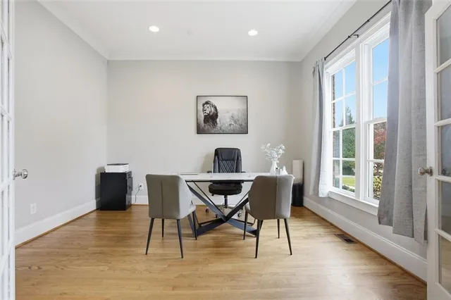 a workspace with furniture window and wooden floor