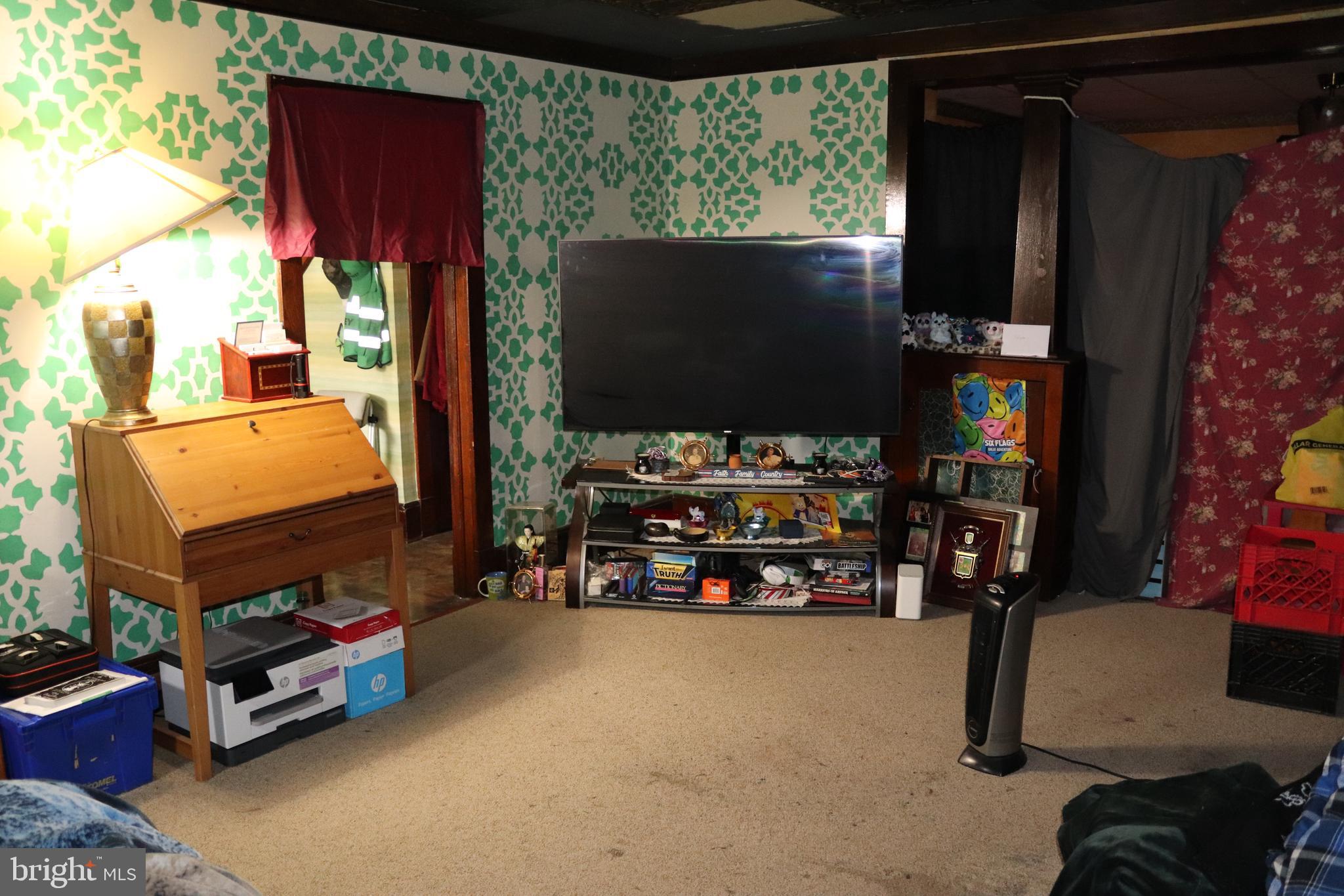 200 Union Street Salem, NJ 08079 - Photo 13 of 26 a room with toys and a flat screen tv