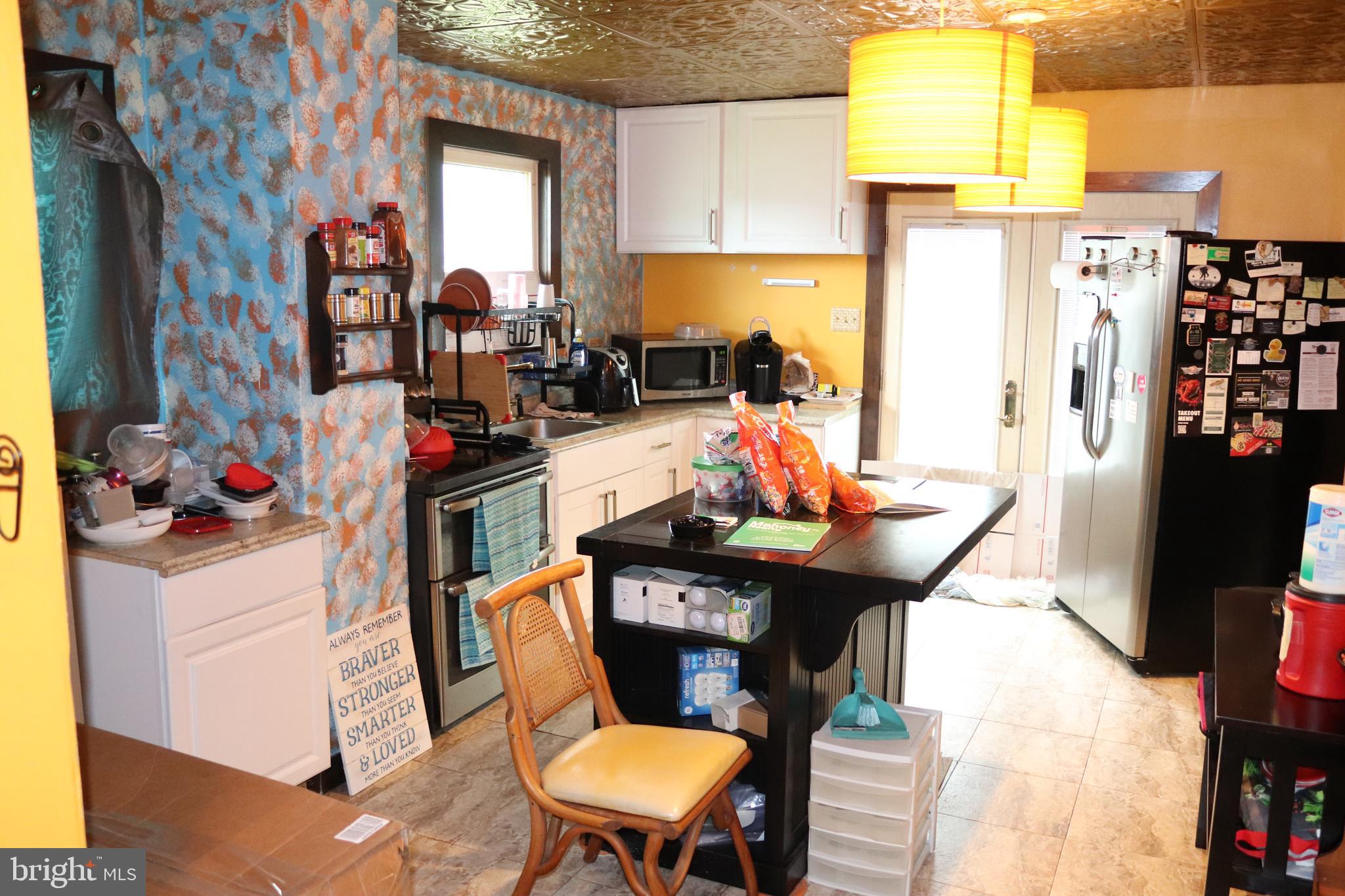 200 Union Street Salem, NJ 08079 - Photo 14 of 26 a living room with furniture and a flat screen tv