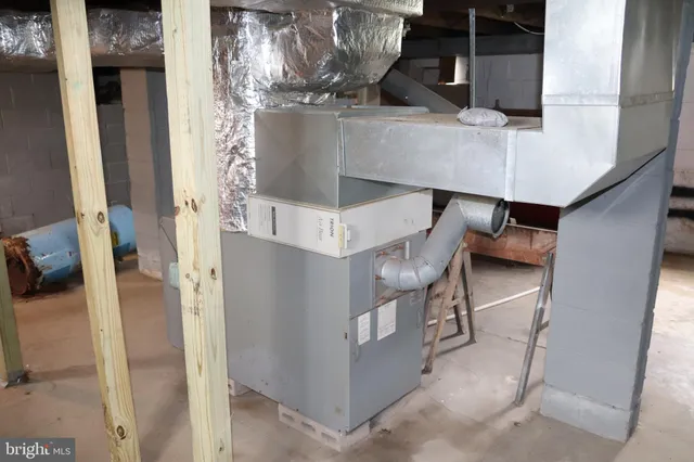a view of living room with furniture and a chandelier
