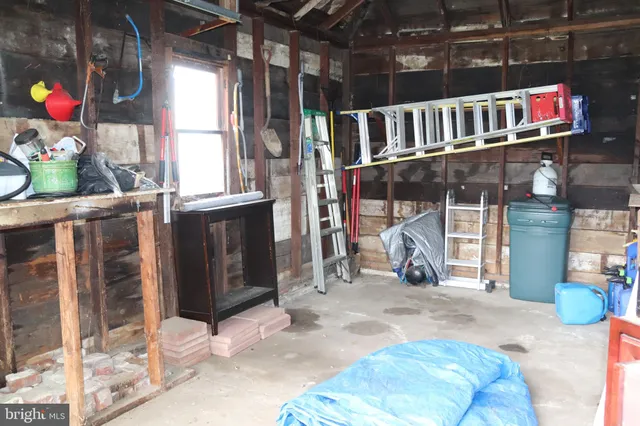 a view of a house with a patio and a garage