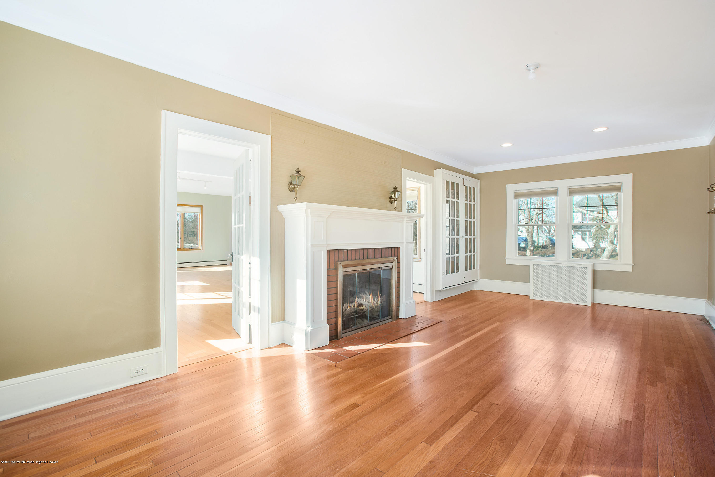 35 Boston Road Neptune City, NJ 07753 - Photo 18 of 30 an empty room with wooden floor fireplace and windows