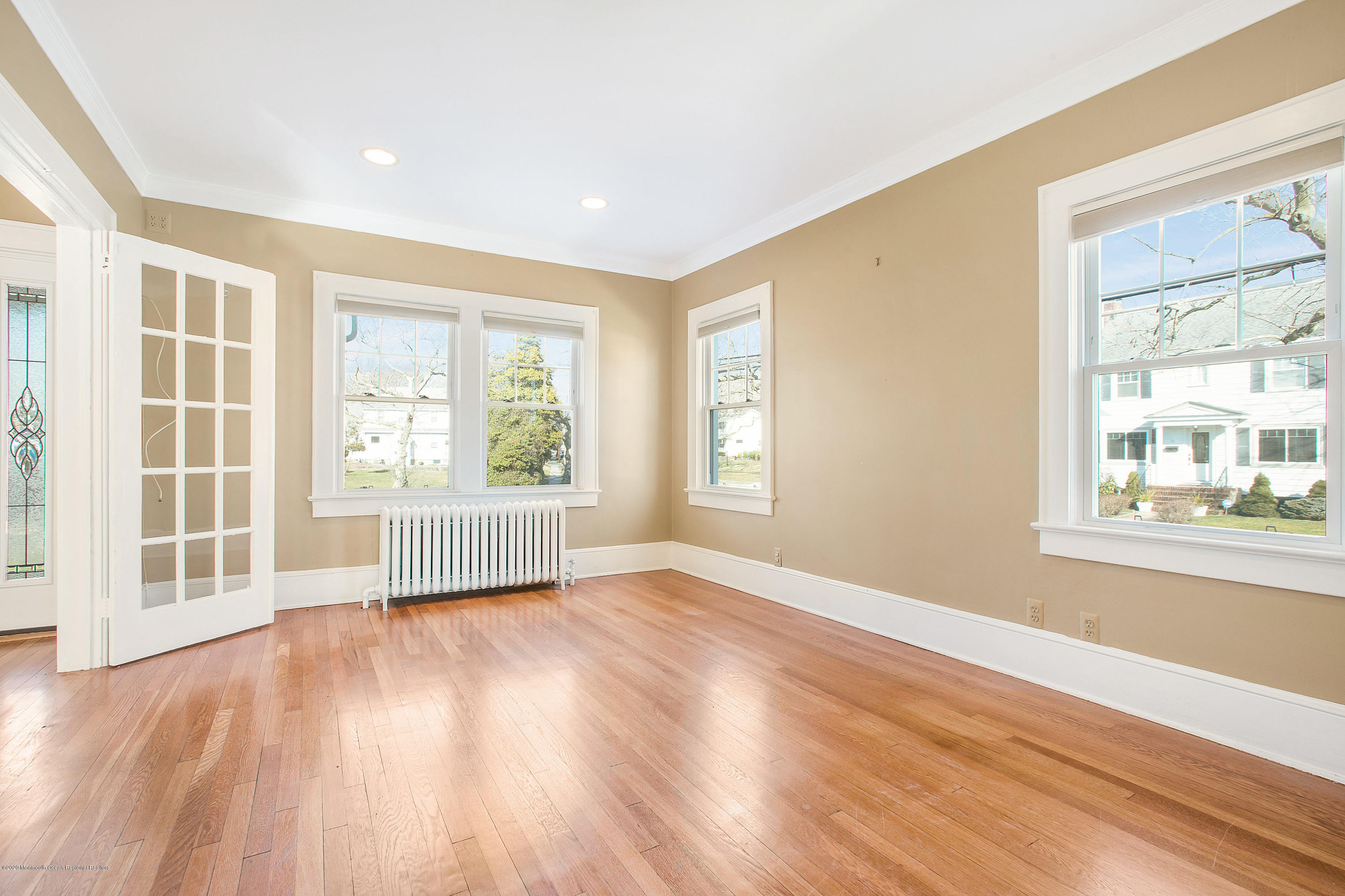35 Boston Road Neptune City, NJ 07753 - Photo 21 of 30 a view of an empty room with wooden floor and a window