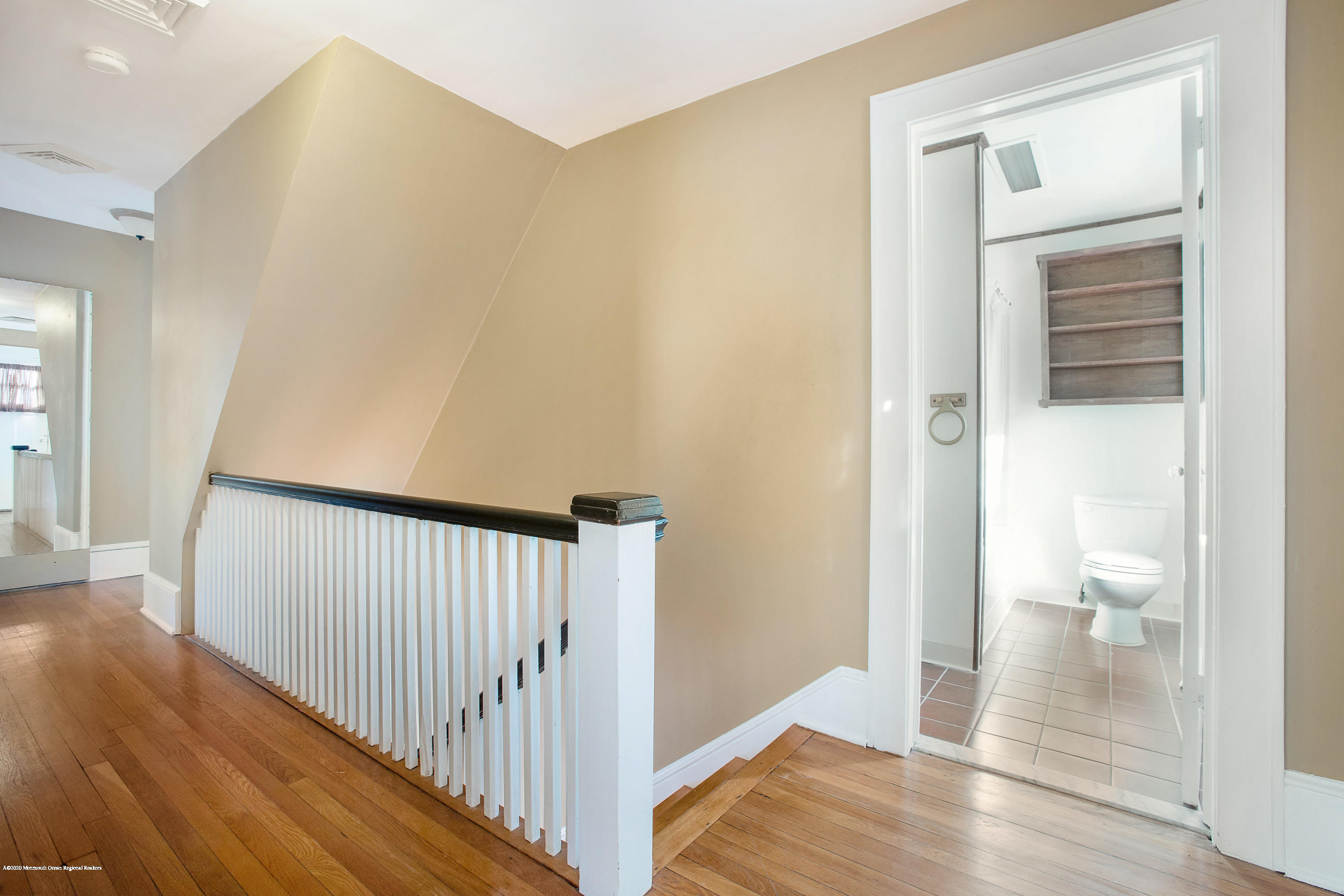 35 Boston Road Neptune City, NJ 07753 - Photo 24 of 30 a view of a hallway with wooden floor and a bathroom