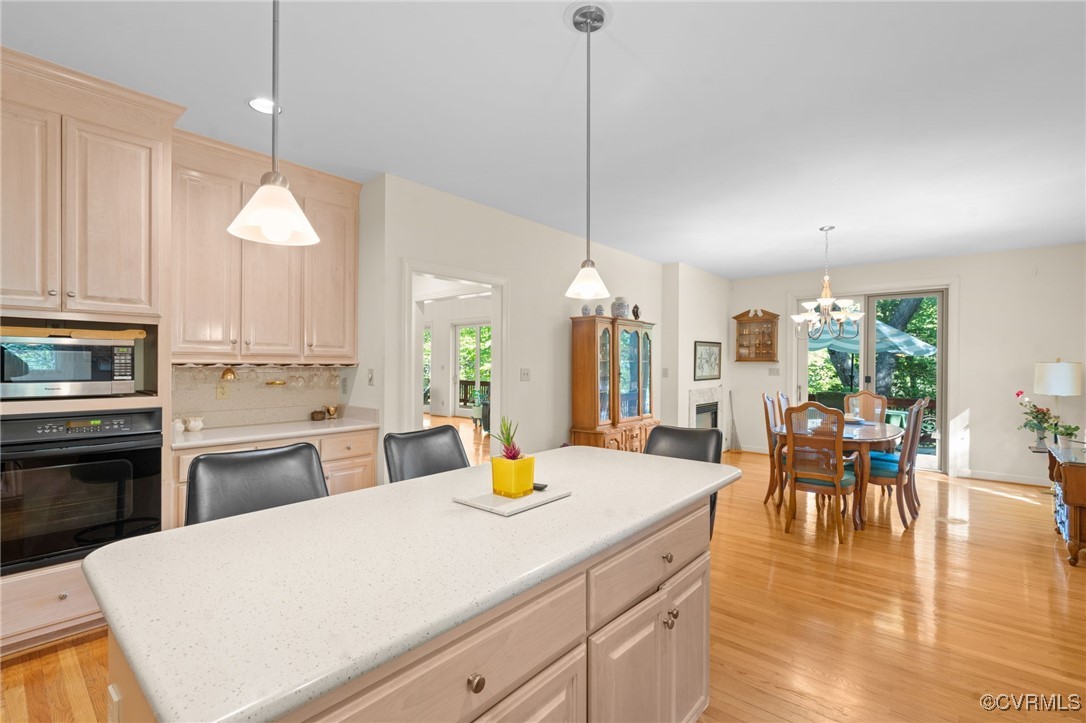 108 Conies Run Williamsburg, VA 23185 - Photo 30 of 50 a kitchen with a dining table chairs stainless steel appliances and cabinets