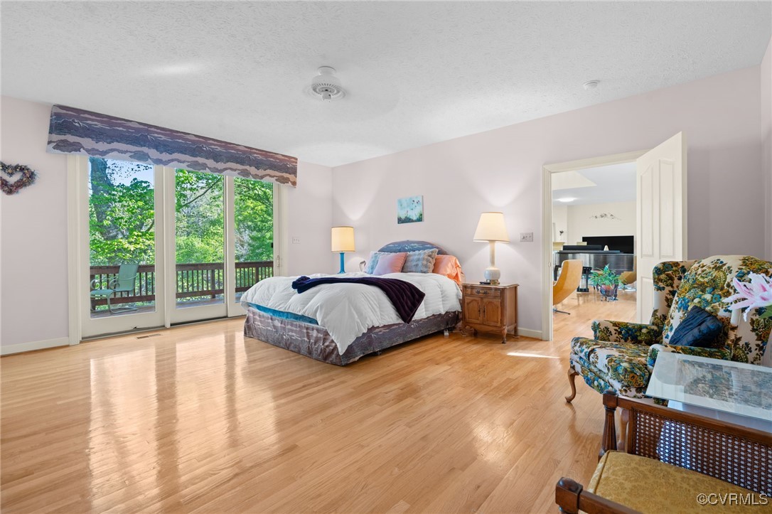 108 Conies Run Williamsburg, VA 23185 - Photo 33 of 50 a spacious bedroom with a bed a table and a large window