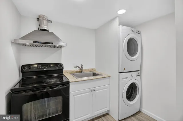 a kitchen with a stove and a sink