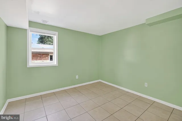 a view of a big room with windows