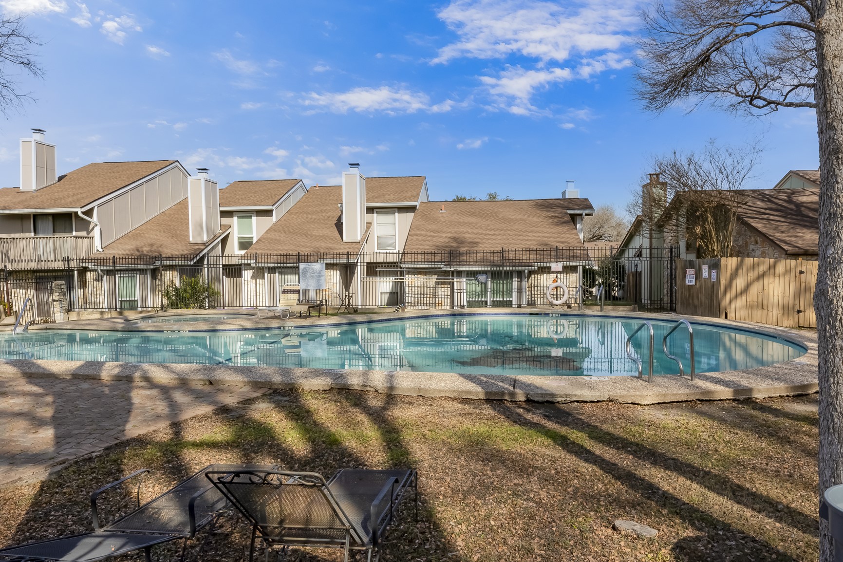 1740 Timber Ridge Road, Unit 136 Austin, TX 78741 - Photo 26 of 32 a view of multiple houses with a yard