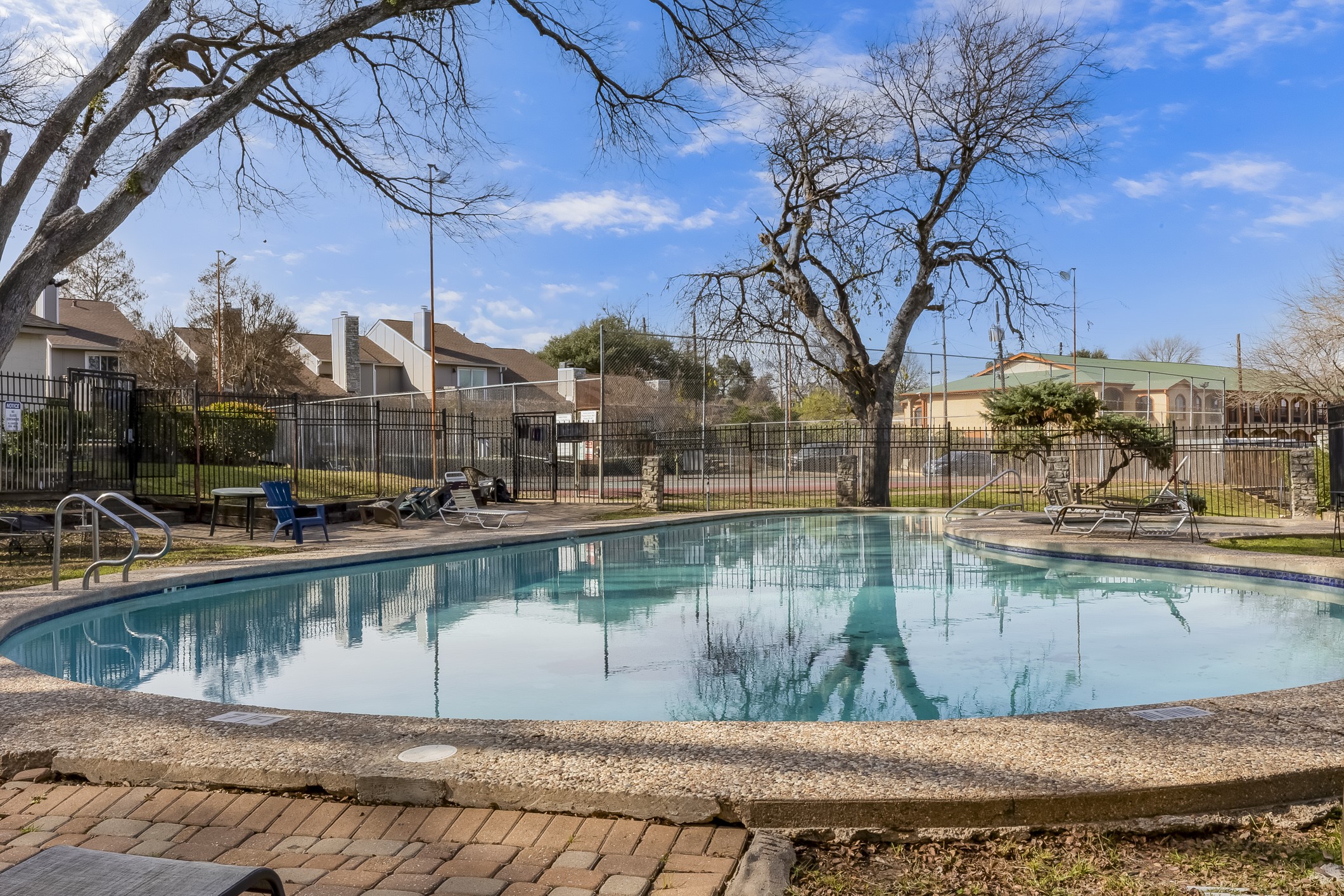 1740 Timber Ridge Road, Unit 136 Austin, TX 78741 - Photo 27 of 32 a view of swimming pool with outdoor seating