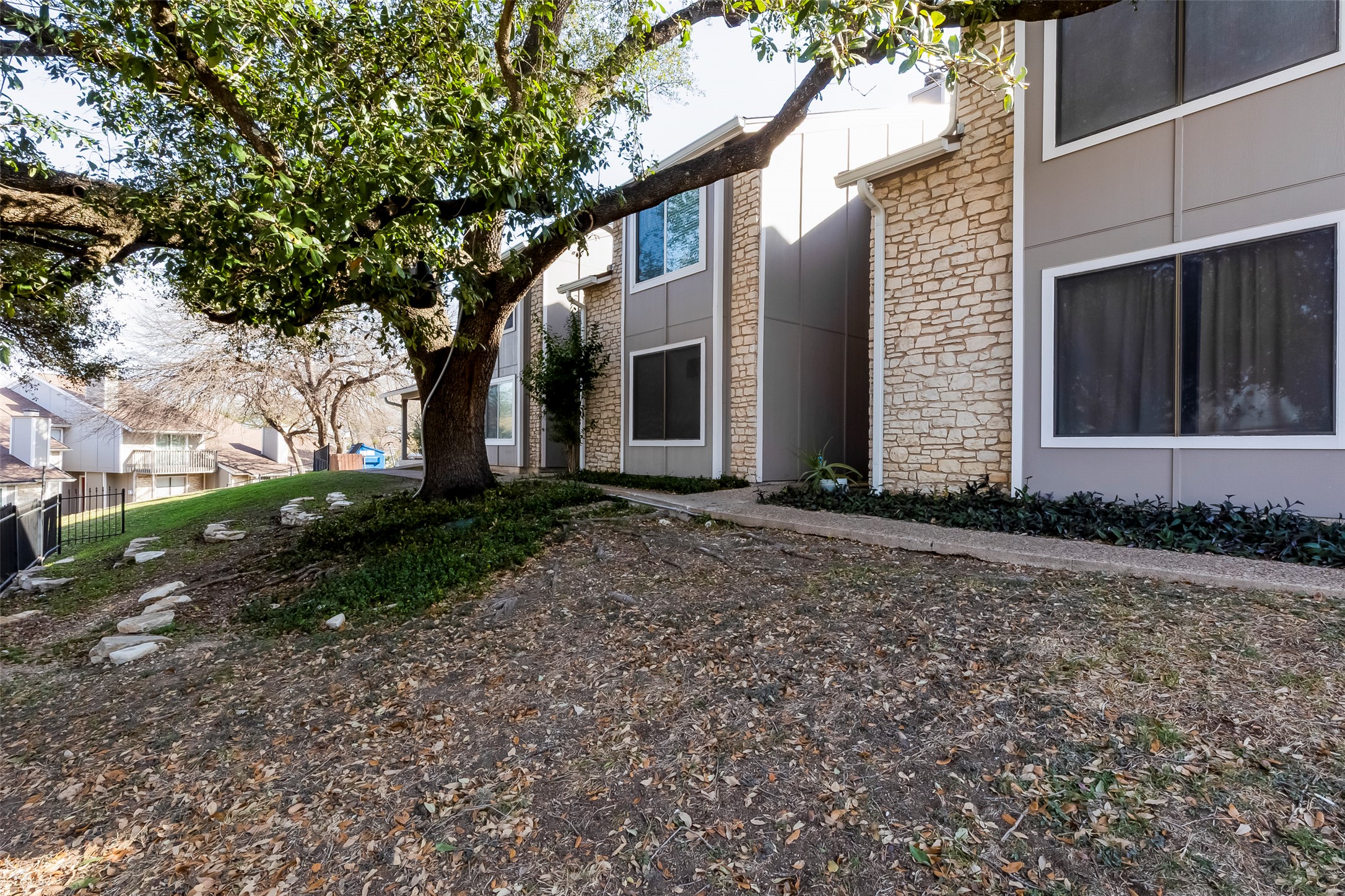 1740 Timber Ridge Road, Unit 136 Austin, TX 78741 - Photo 3 of 32 a view of a house with a yard