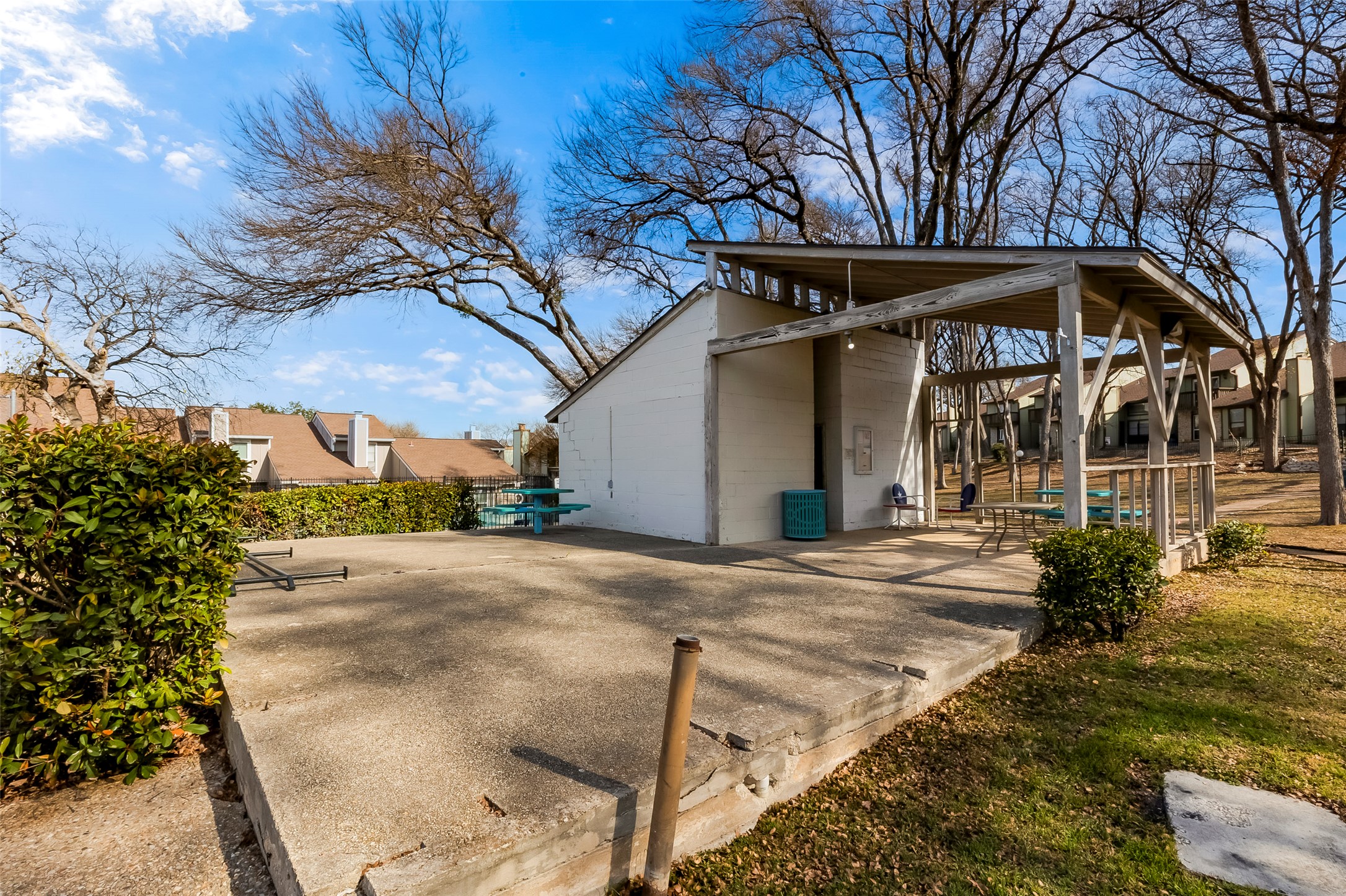 1740 Timber Ridge Road, Unit 136 Austin, TX 78741 - Photo 31 of 32 a house with trees in front of it