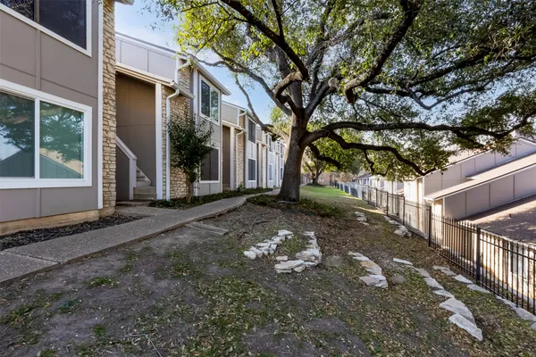 a view of a house with a tree