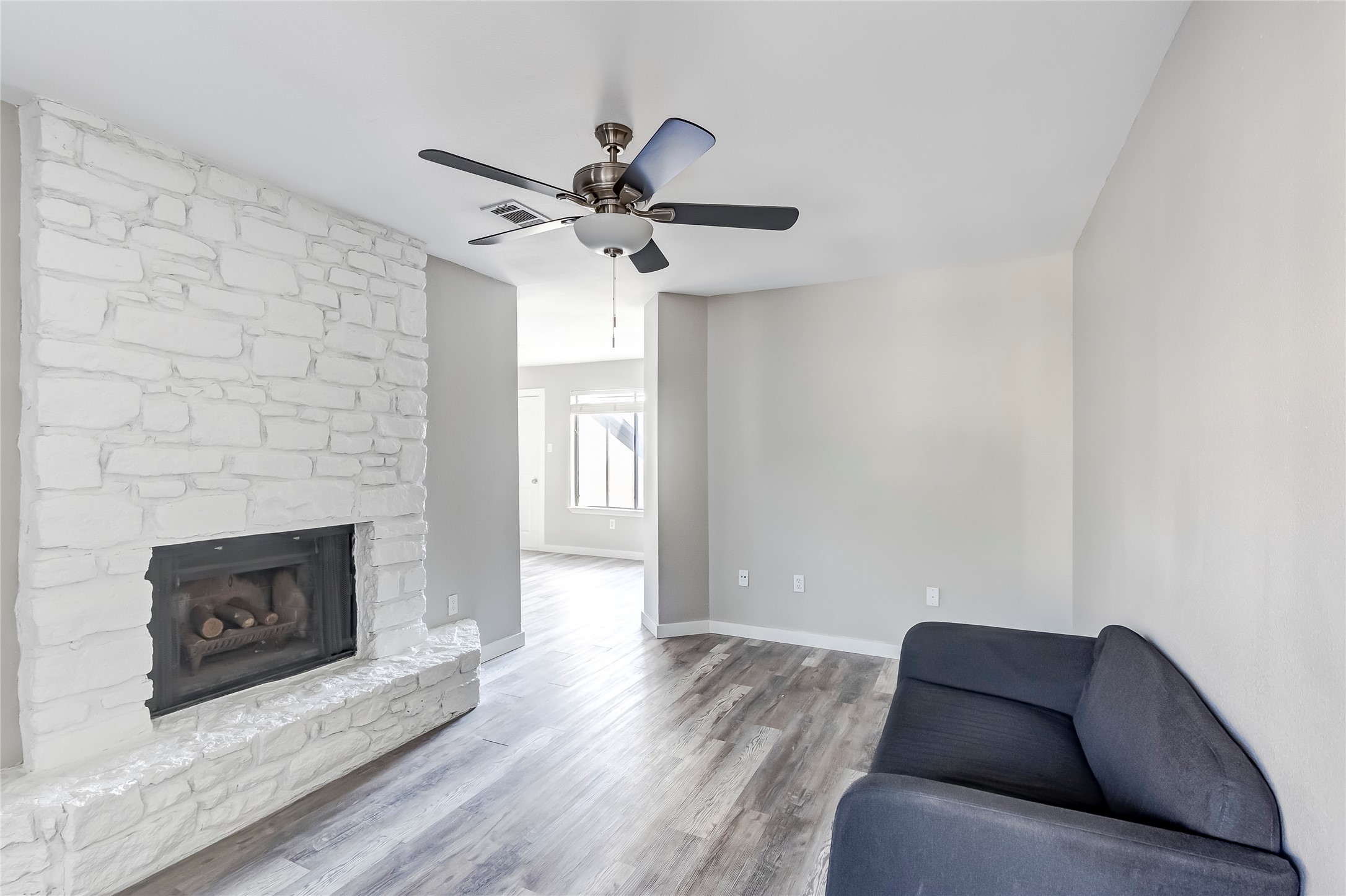 1740 Timber Ridge Road, Unit 136 Austin, TX 78741 - Photo 8 of 32 a living room with furniture and a fireplace