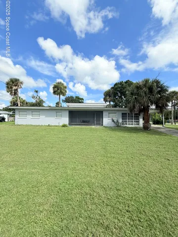 a view of a house with a big yard