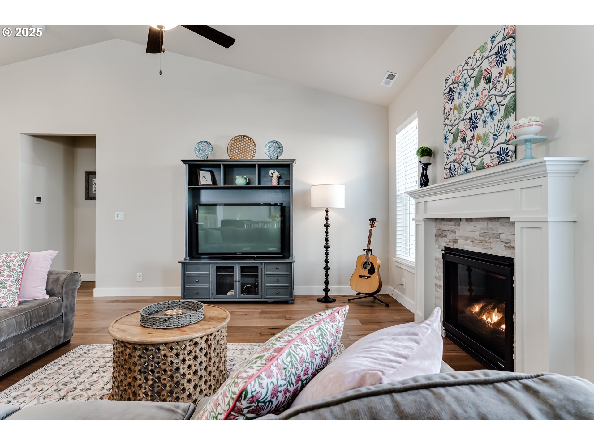 3266 Mountain Crk Lane Springfield, OR 97478 - Photo 14 of 42 a living room with furniture a flat screen tv and a fireplace