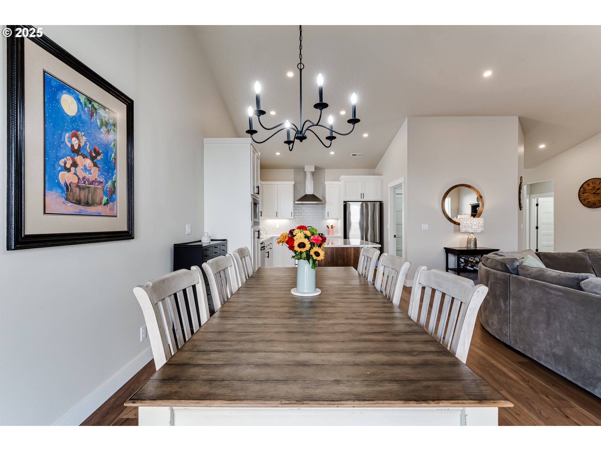 3266 Mountain Crk Lane Springfield, OR 97478 - Photo 16 of 42 a view of a dining room with furniture a chandelier and wooden floor