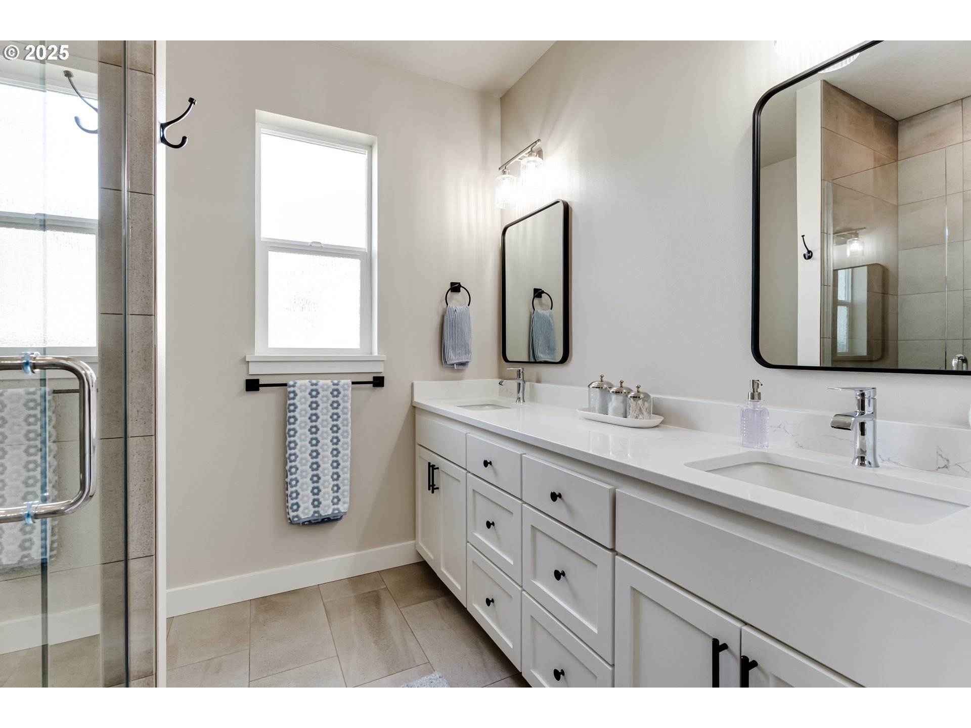 3266 Mountain Crk Lane Springfield, OR 97478 - Photo 24 of 42 a bathroom with double vanity sink two mirror and a window