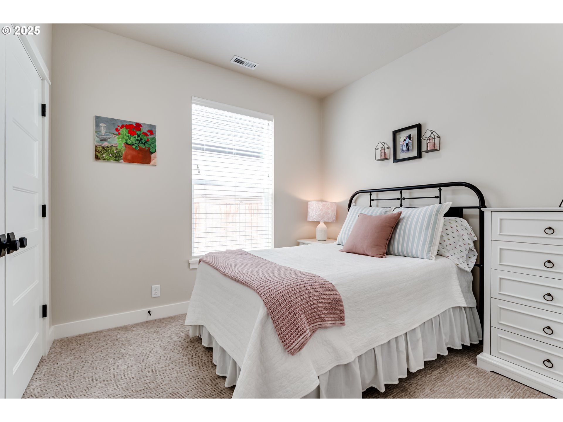 3266 Mountain Crk Lane Springfield, OR 97478 - Photo 27 of 42 a bedroom with a bed and a painting on the wall