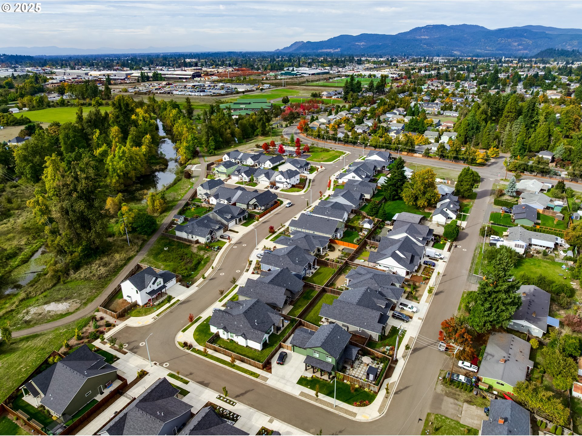 3266 Mountain Crk Lane Springfield, OR 97478 - Photo 31 of 42 an aerial view of residential houses with outdoor space and swimming pool