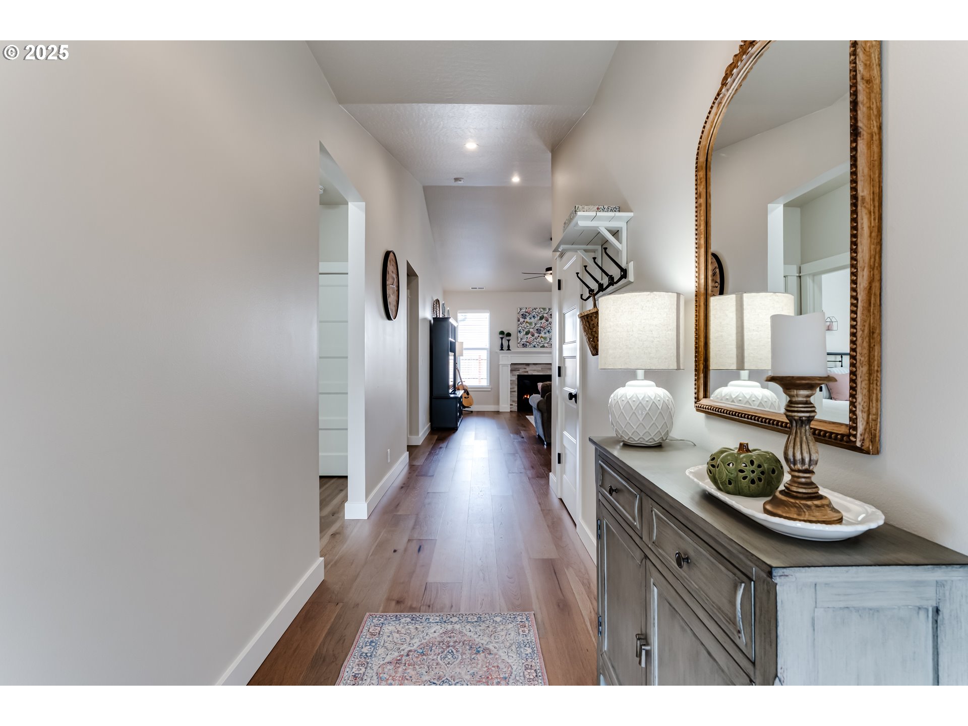 3266 Mountain Crk Lane Springfield, OR 97478 - Photo 4 of 42 a hallway with dining area and chandelier