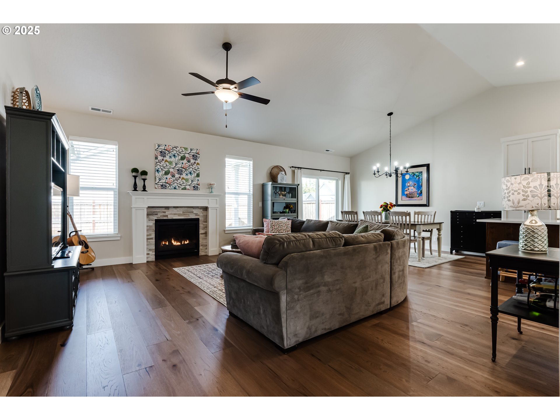 3266 Mountain Crk Lane Springfield, OR 97478 - Photo 7 of 42 a living room with furniture a fireplace and a flat screen tv