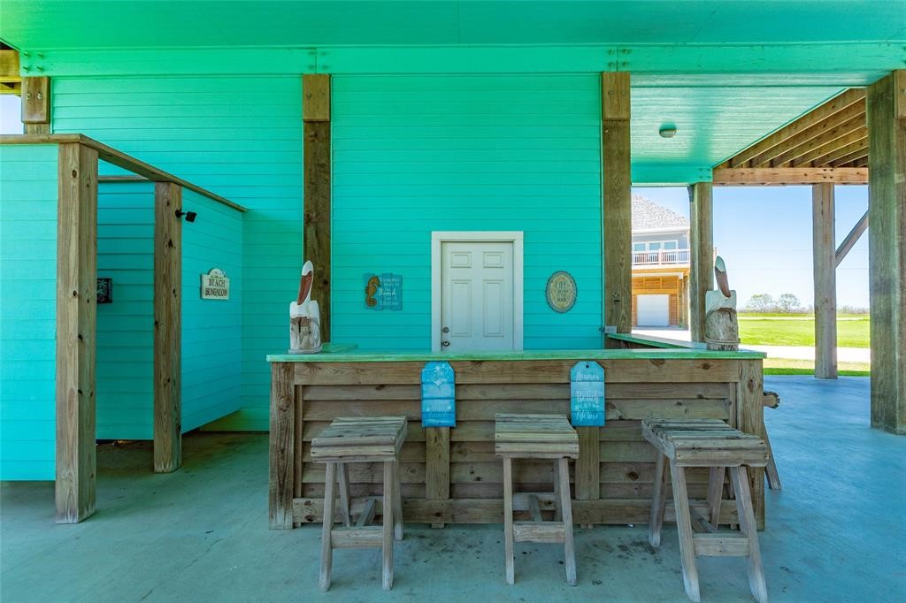987 Surf Crystal Beach Crystal Beach, TX 77650 - Photo 33 of 45 a view of a dining room with furniture and window