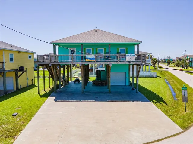 a aerial view of a house with a garden and pool