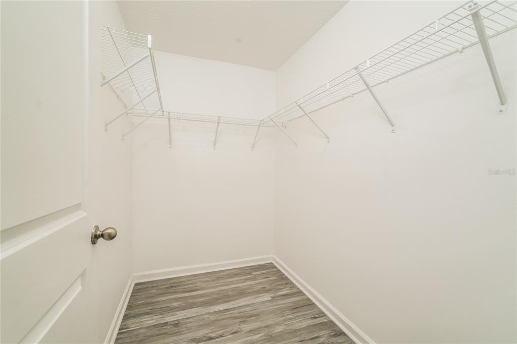1473 Lucerne Loop Road Northeast Winter Haven, FL 33881 - Photo 13 of 25 a view of a room with racks on the wall