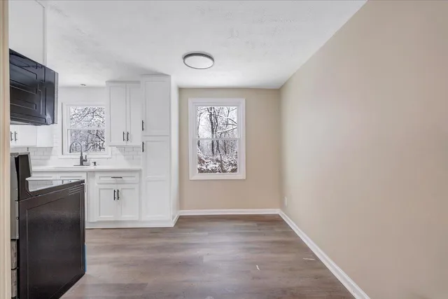 a bathroom with a sink a vanity and a mirror