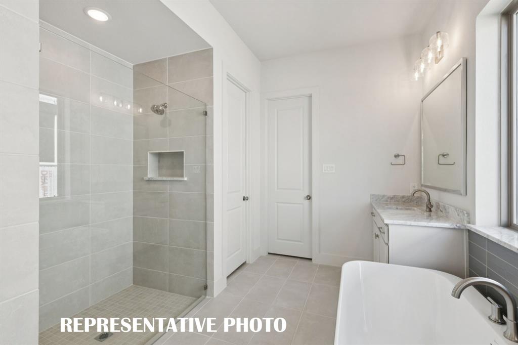 3909 Launch Road McKinney, TX 75071 - Photo 11 of 17 a bathroom with a toilet sink and shower