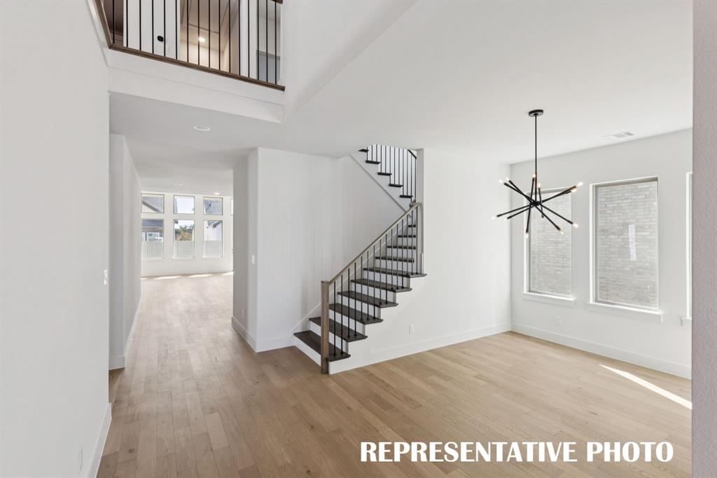 3909 Launch Road McKinney, TX 75071 - Photo 4 of 17 a view interior of a house with wooden floor and stairs