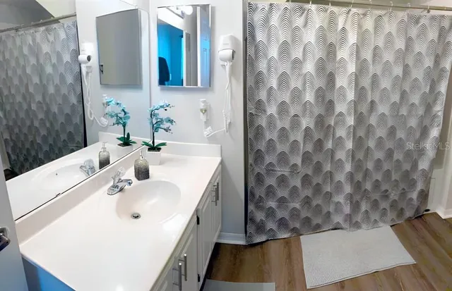 a bedroom with a bed and a lamp