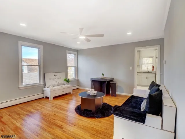 a living room with furniture and a window