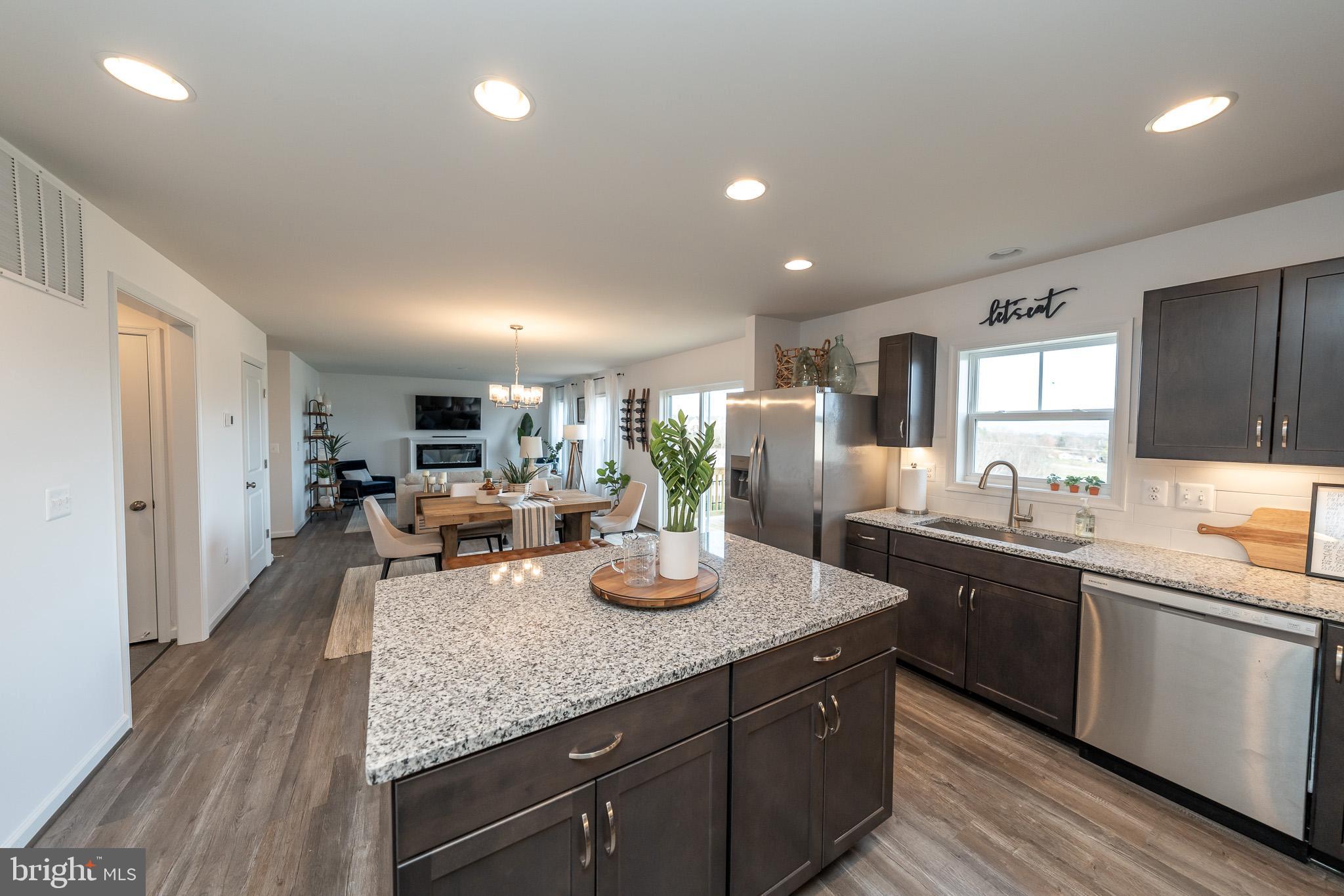 121 Indian Hills Road Locust Grove, VA 22508 - Photo 13 of 26 a kitchen with lots of counter top space and living room