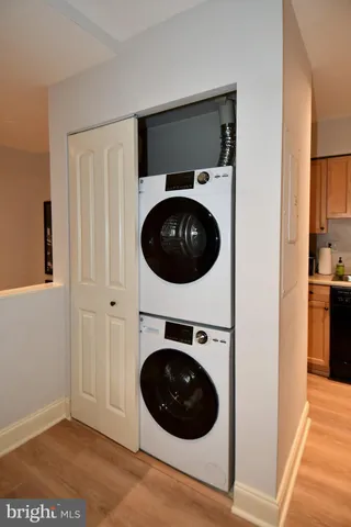 a view of a hallway with washer and dryer