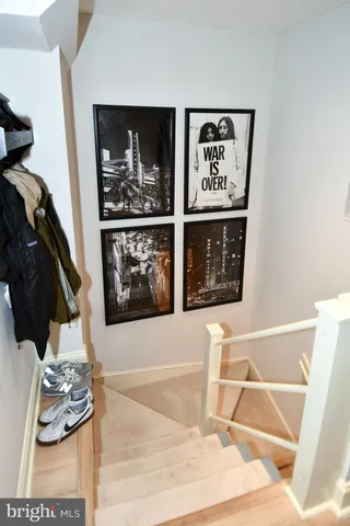 a living room with furniture and wall painting on the wall