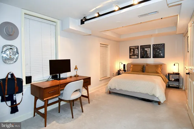 a bedroom with a bed and a chair