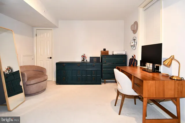 a view of a workspace with furniture