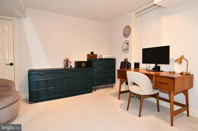 a view of a workspace with furniture