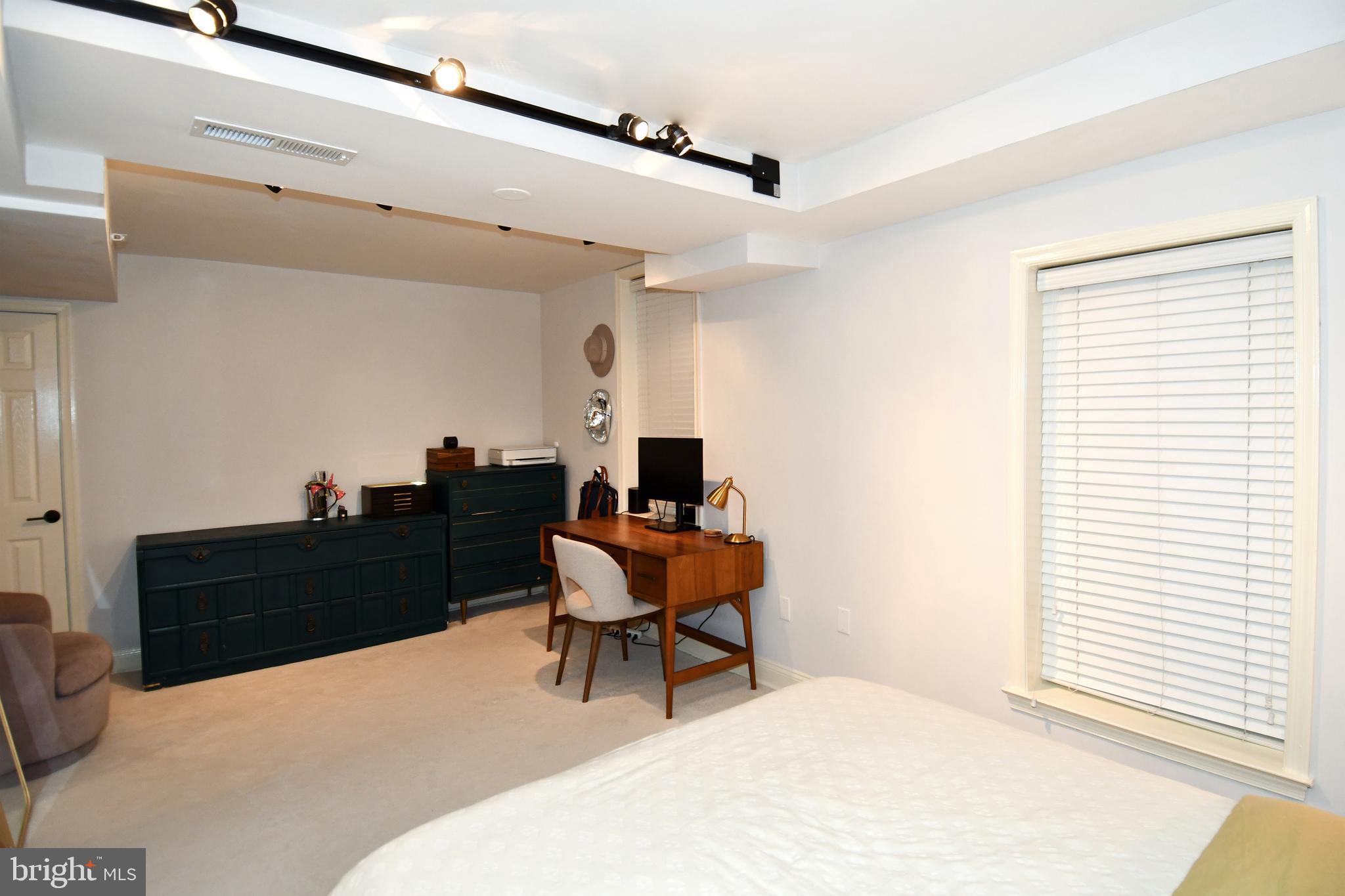 1731 Willard Street Northwest, Unit 105 Washington, DC 20009 - Photo 26 of 52 a room with a bed and a window