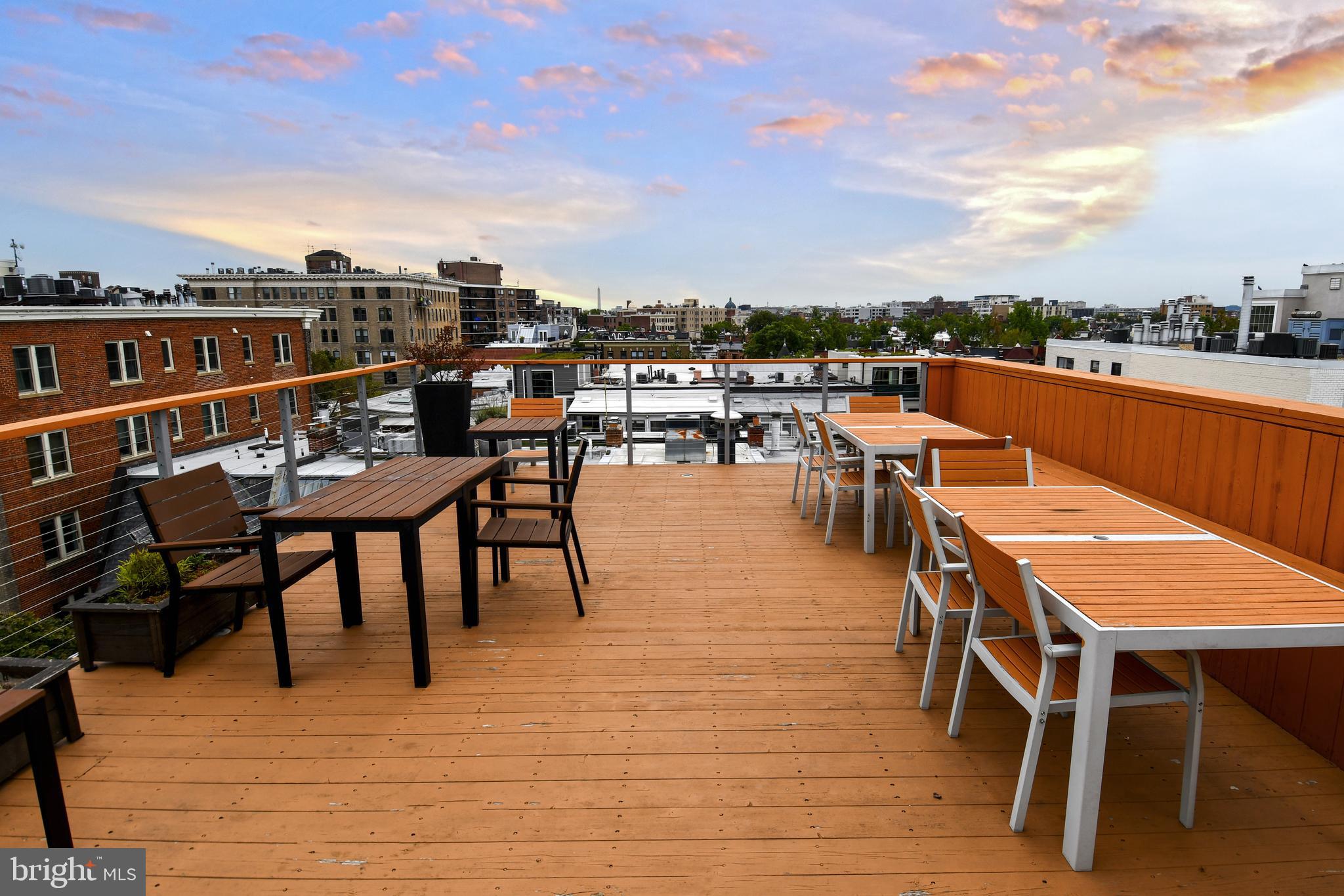 1731 Willard Street Northwest, Unit 105 Washington, DC 20009 - Photo 35 of 52 a terrace with outdoor seating and city view