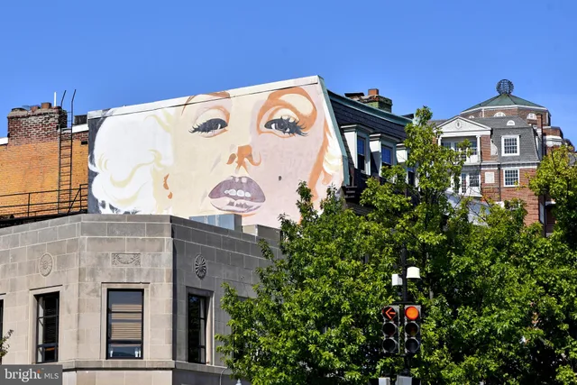 a view of a building with retail shops