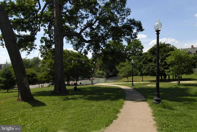 a sign that is in front of flowers