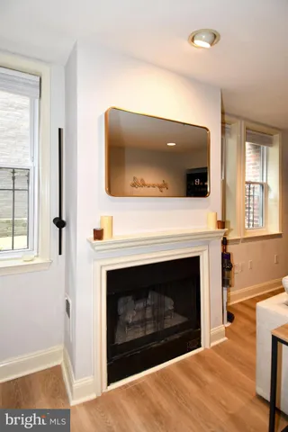 a living room with a fireplace and a flat screen tv