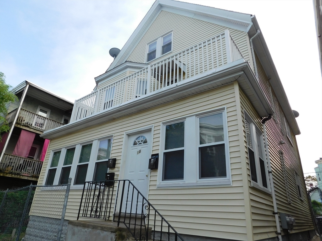 18 Hendry Street, Unit 2 Boston, MA 02122 - Photo 1 of 15 a view of a house with a deck