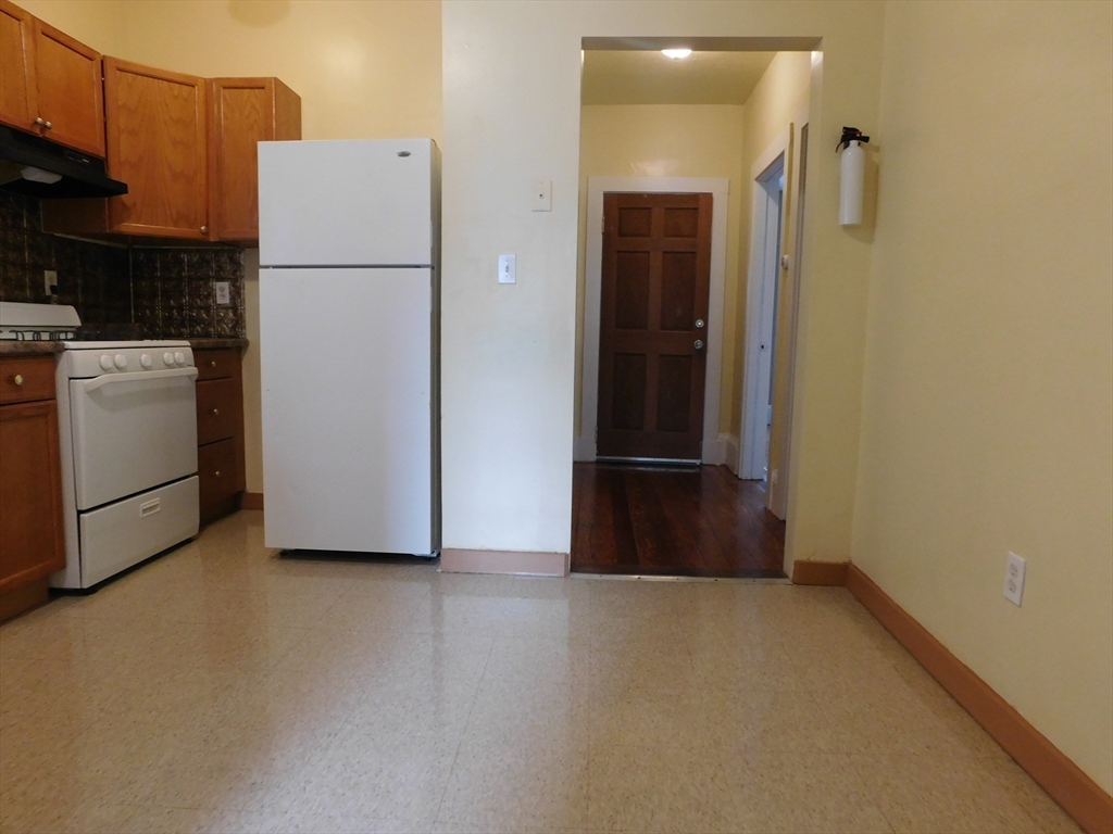 18 Hendry Street, Unit 2 Boston, MA 02122 - Photo 5 of 15 a view of storage and utility room with washer and dryer
